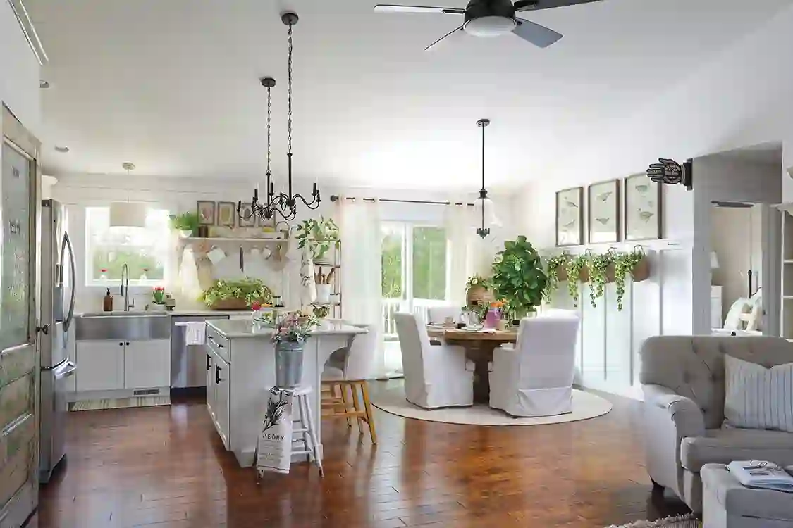 white kitchen and dining room with slipcovered chairs