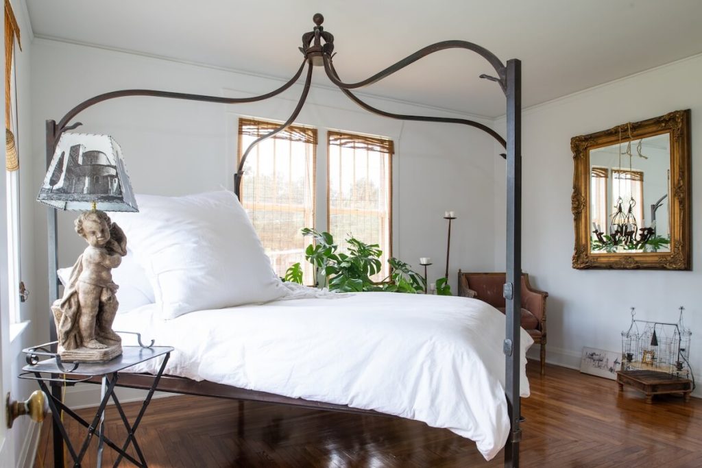 canopy bed with vintage and antique accent furniture