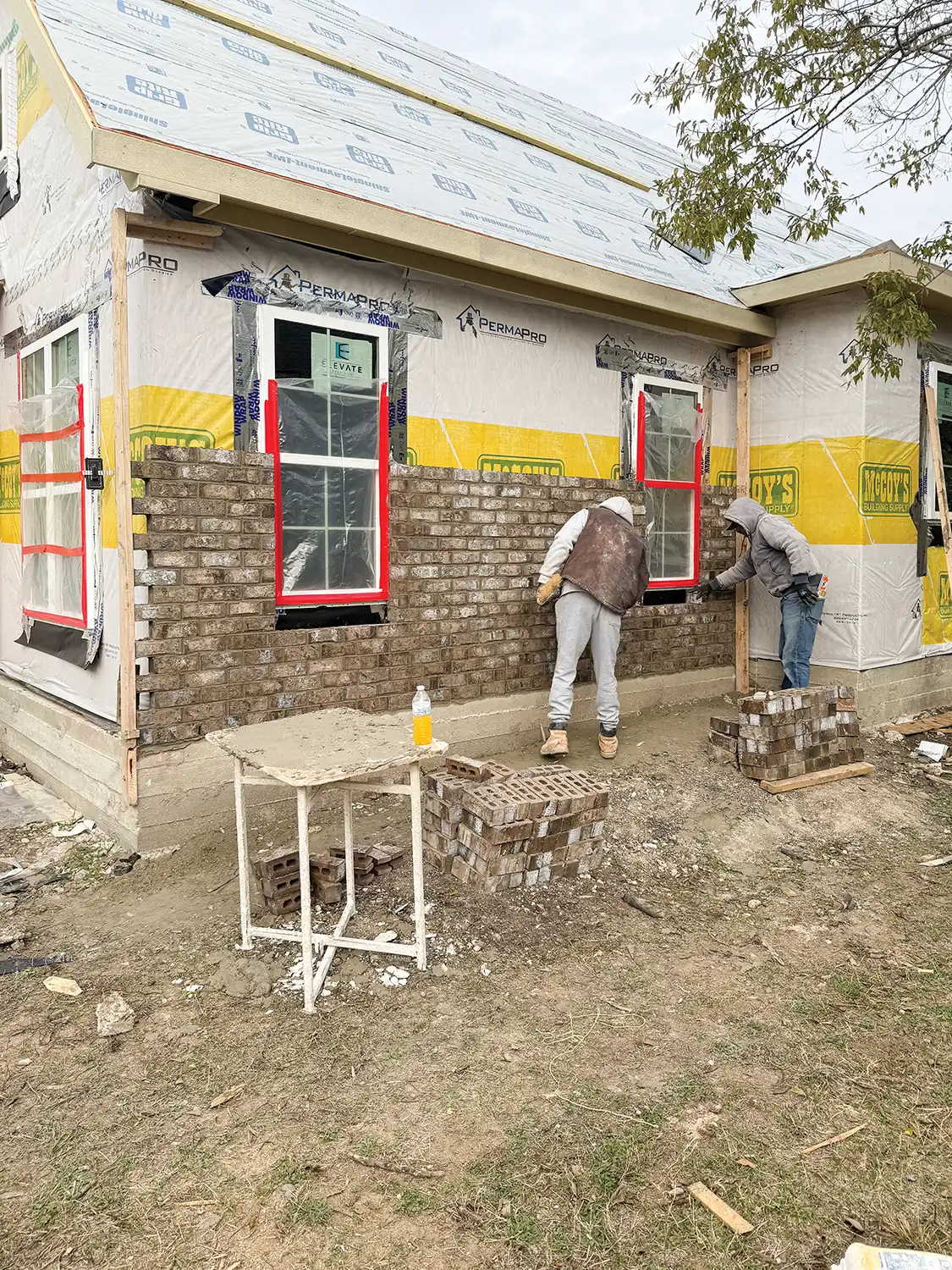 exterior brick installation at Project House Austin from page to pavement