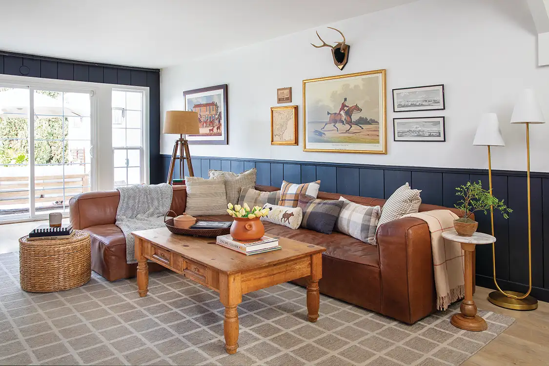 gallery wall in living room with leather sectional sofa