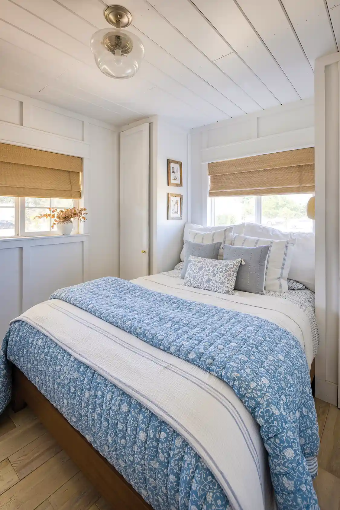 bedroom with cozy blue and white bedding