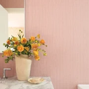 pink and white striped wallpaper in bathroom