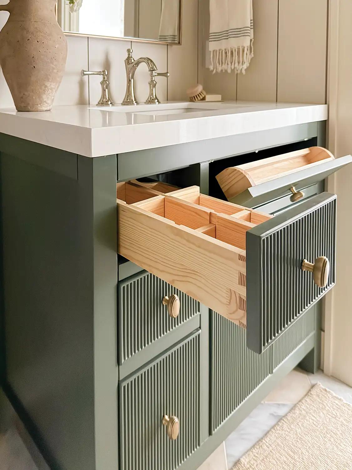 green vanity with storage drawers